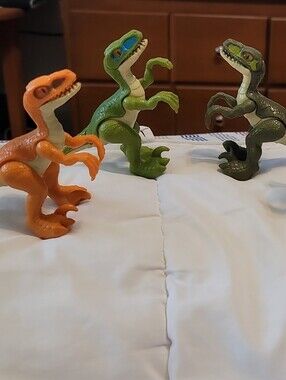 Set of 4 Toy Velociraptor Figures,Orange,Green, Olive,White Jurassic Dinosaurs